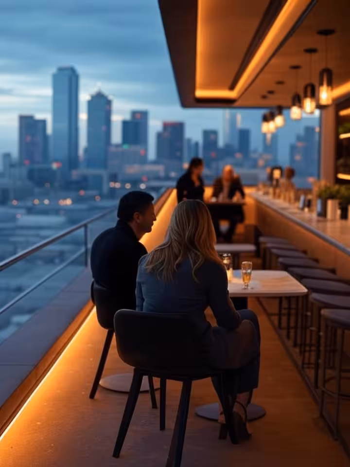 Modern upscale rooftop bar in Dallas Uptown district at sunset, panoramic city skyline view, contemp