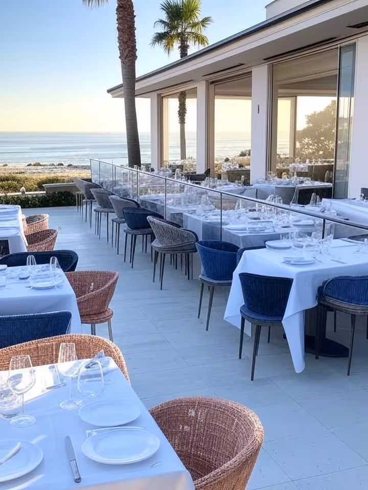 Upscale outdoor restaurant terrace overlooking ocean in La Jolla, modern California coastal architec